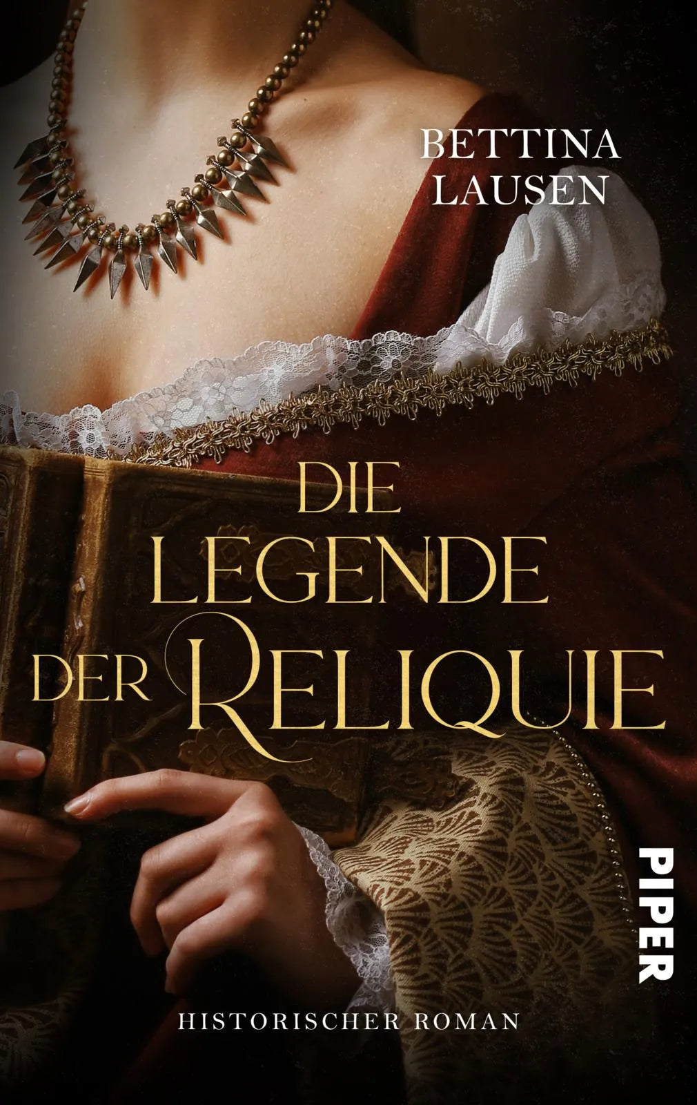 Buchcover von 'Die Legende der Reliquie' - Taschenbuch von Bettina Lausen