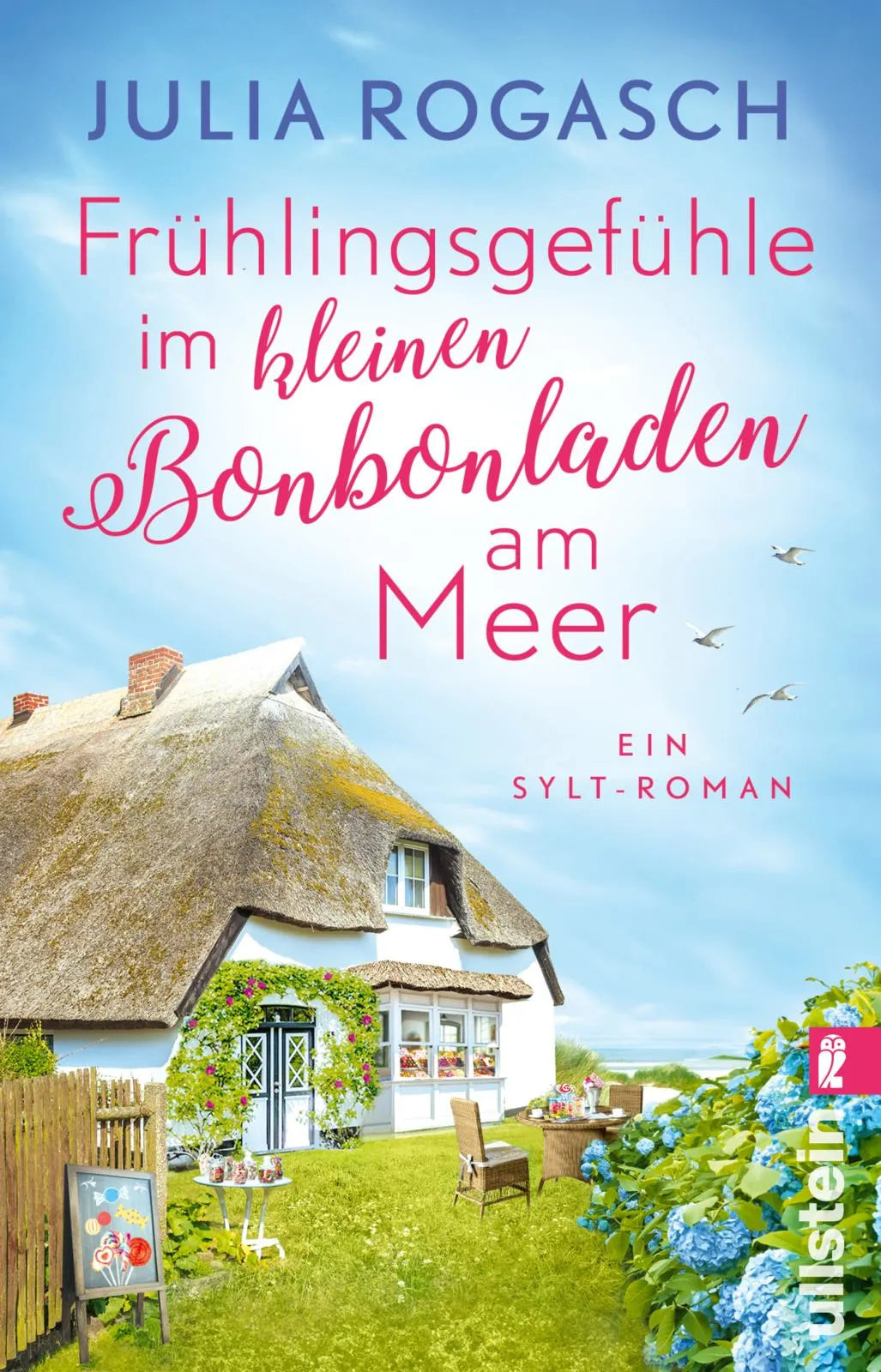 Buchcover von 'Frühlingsgefühle im kleinen Bonbonladen am Meer' - Taschenbuch von Julia Rogasch