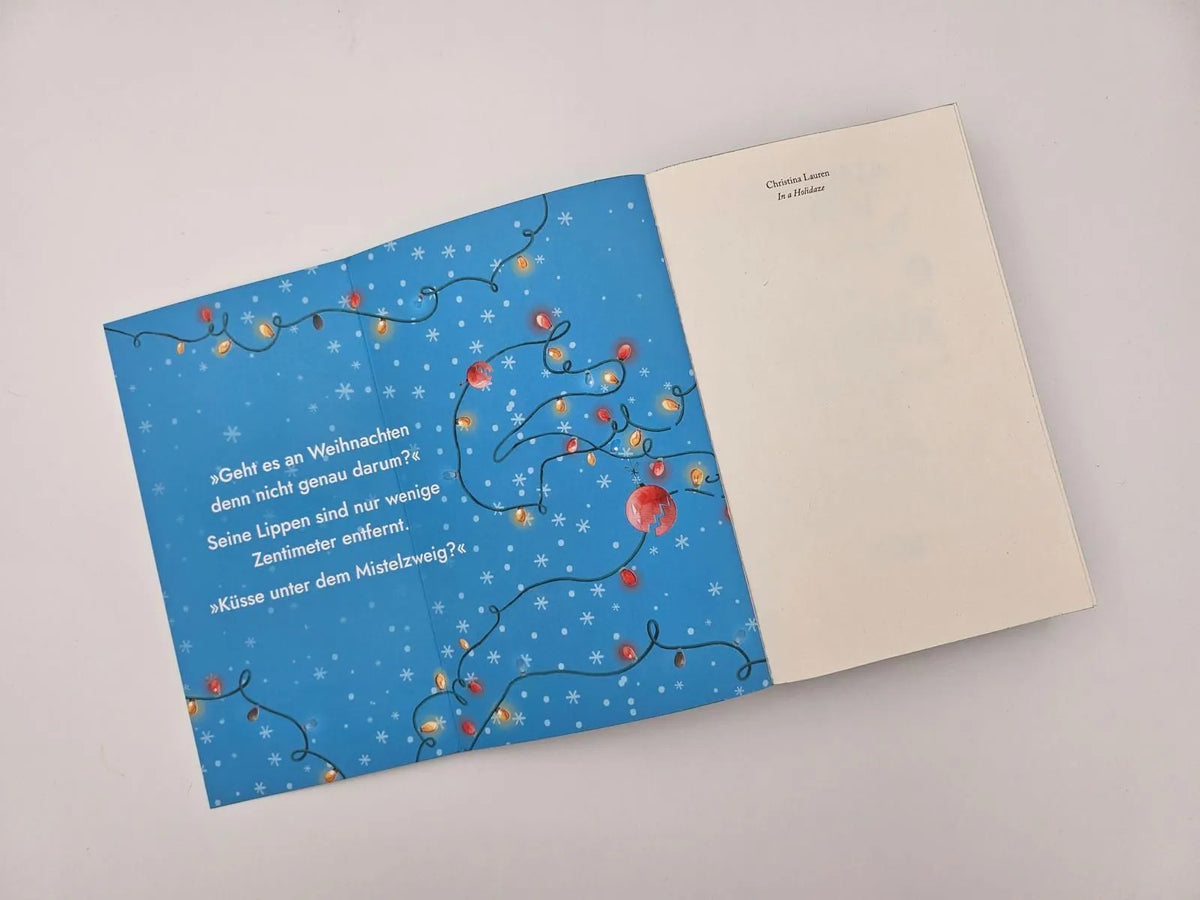 Detailansicht: In a Holidaze – Ihr Weihnachtswunsch führt zu Gefühlschaos unterm Mistelzweig (Paperback)