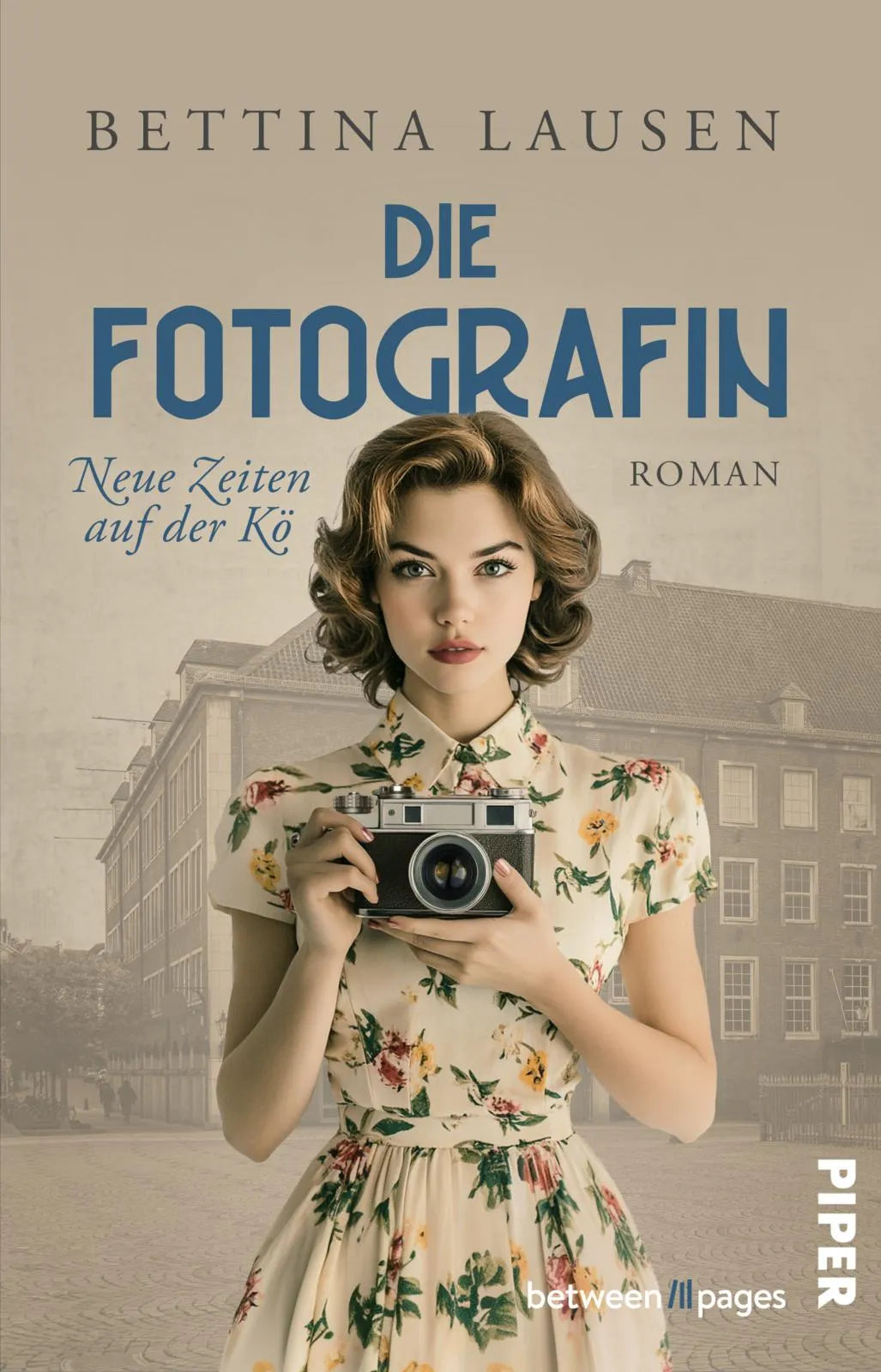 Buchcover von 'Neue Zeiten auf der Kö – Die Fotografin' - Taschenbuch von Bettina Lausen